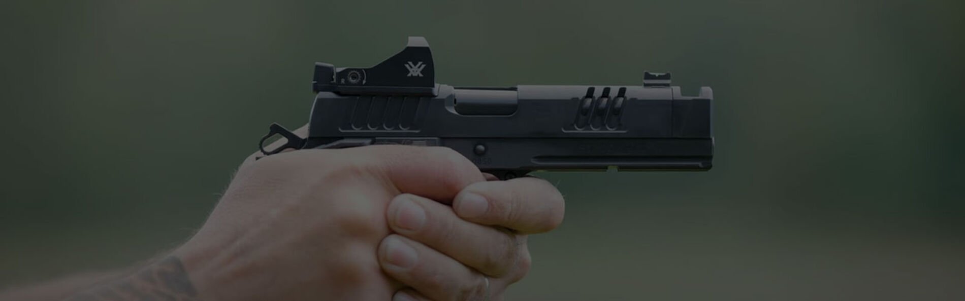 shooter aiming handgun