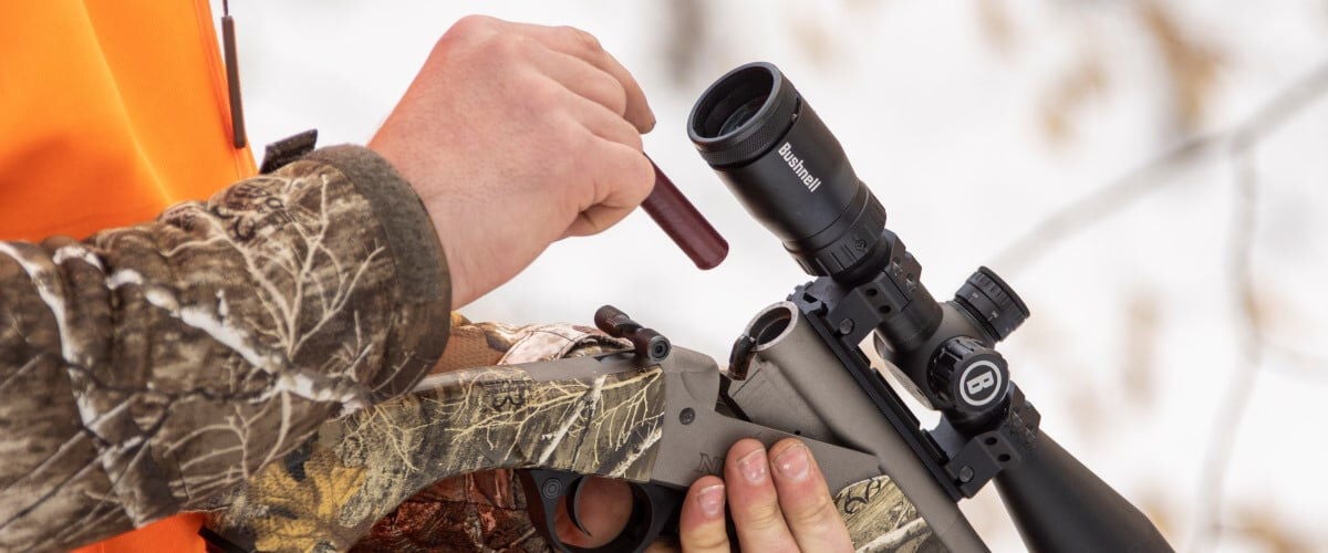 hunter loading FireStick into a muzzleloader