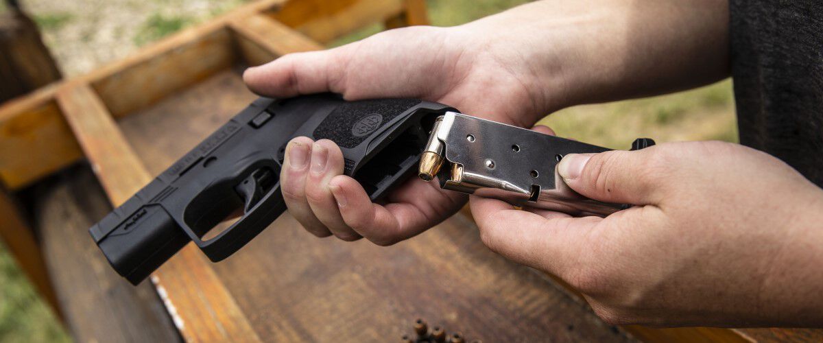 magazine being loaded into a handgun