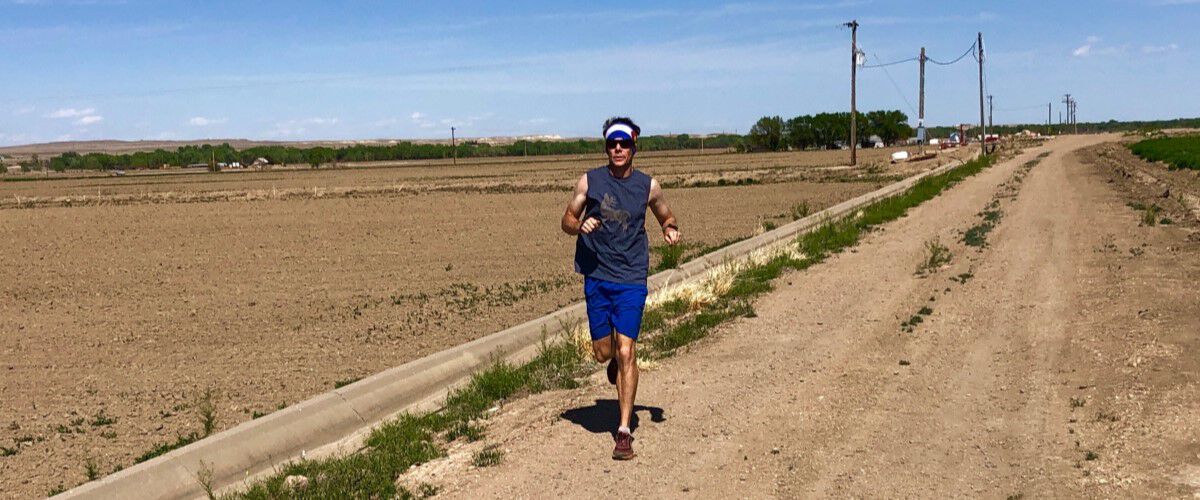 Man running down a dirt road