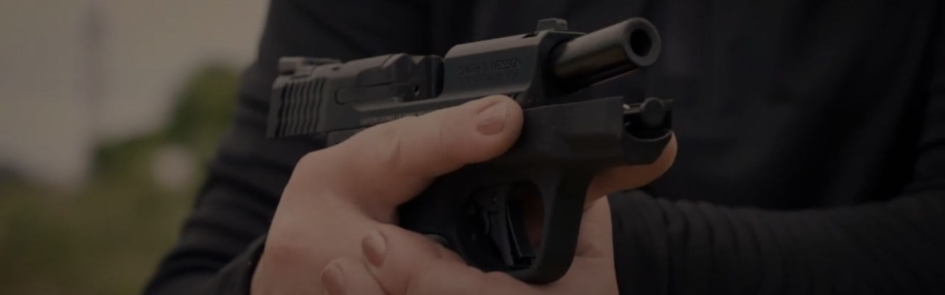 Julie Golob holding a handgun