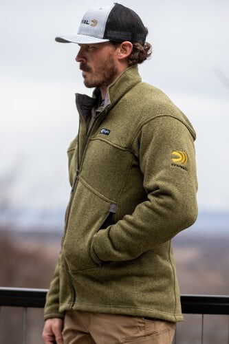 male wearing the Zenith Jacket while standing outside