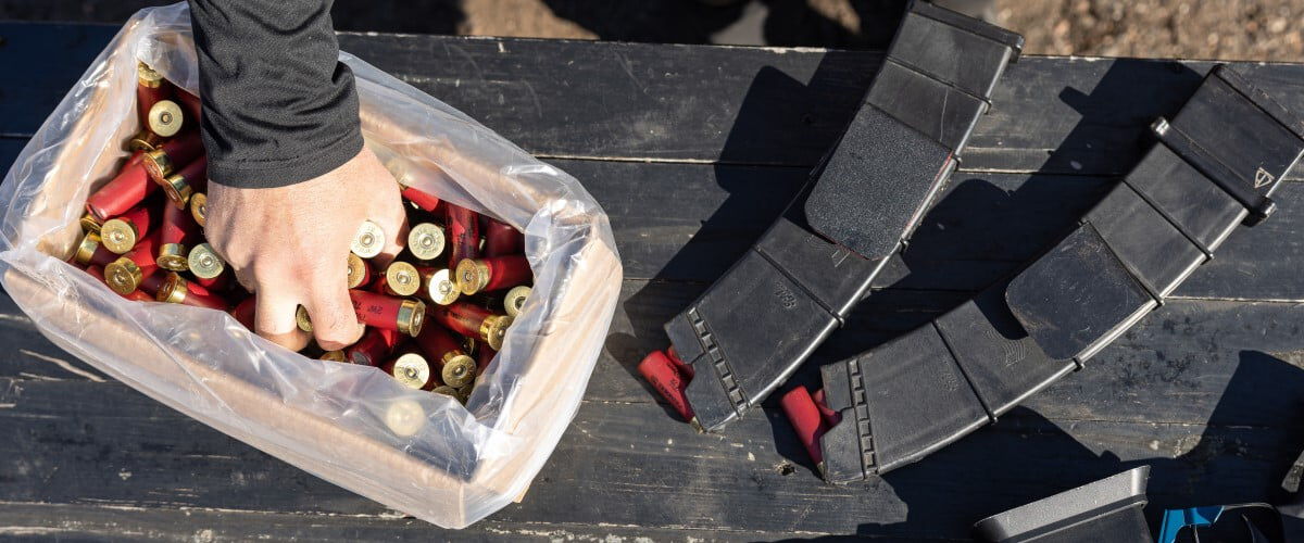 Josh Froleich grabbing shotshells out of a bin