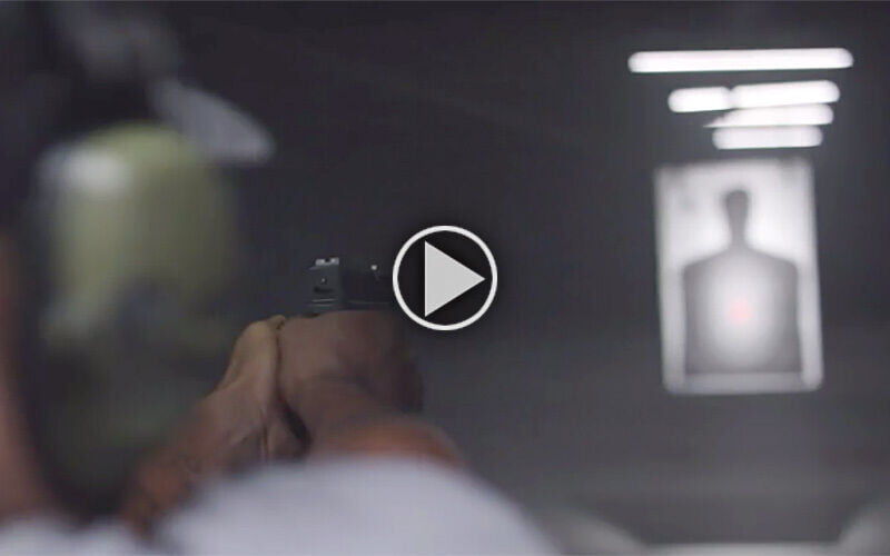 Shooter aimging at a target in an indoor range