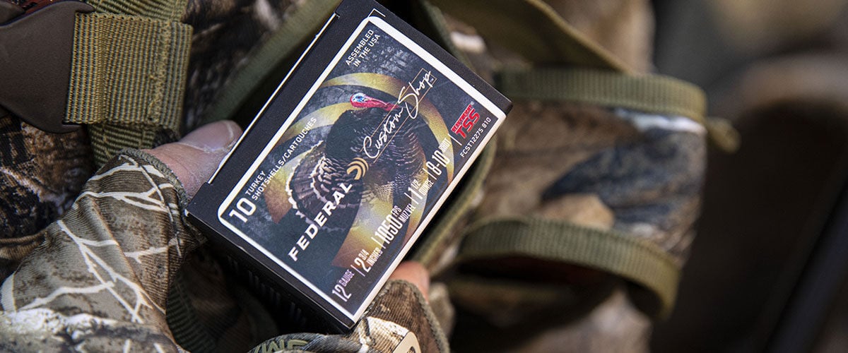 hunter holding box of Custom Shop TSS shotshell