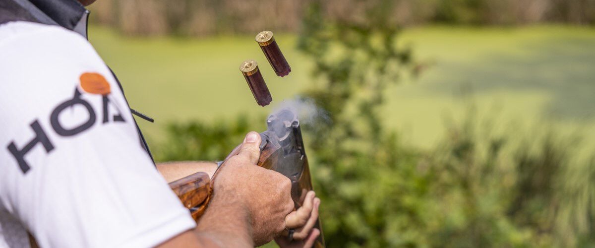 Shot HOA shells being ejected from a shotgun