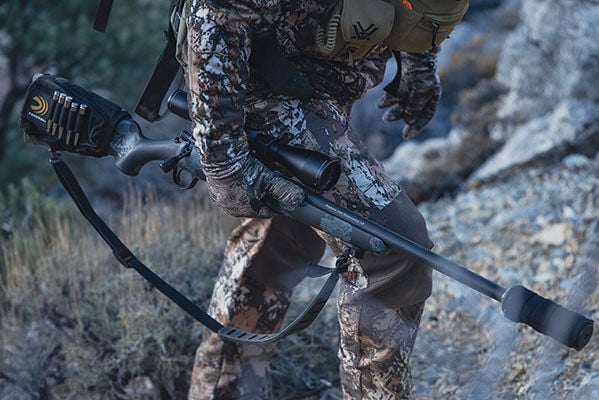 shooter carrying rifle