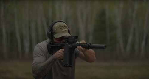 Josh Froelich shooting a rifle