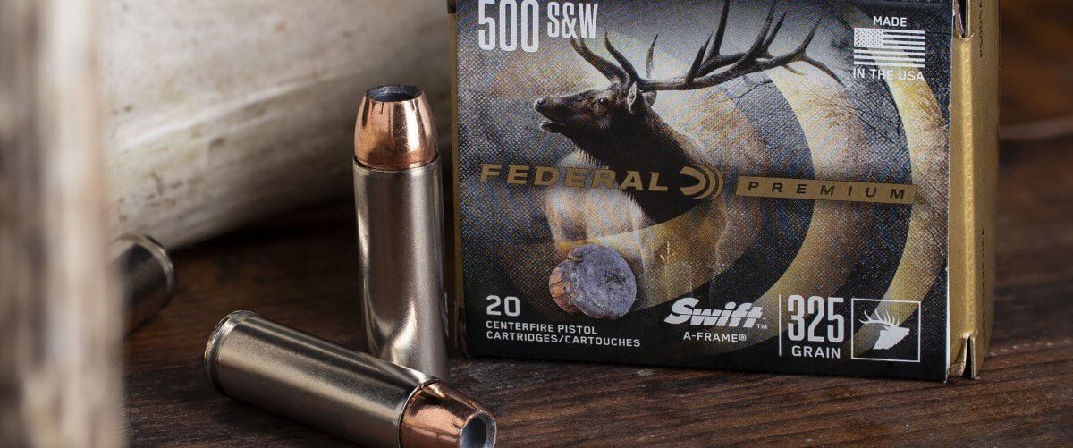 Swift A-Frame packaging and cartridges sitting on a table beside a deer antler