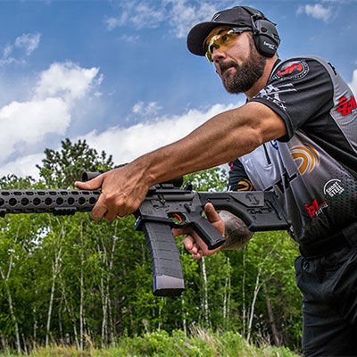 Josh Froelich holding rifle