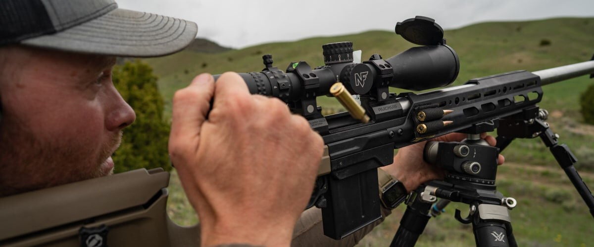 hunter ejecting a shot case from a rifle