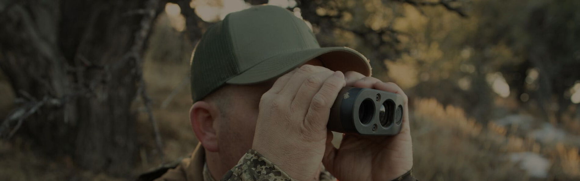 hunter looking through binoculars