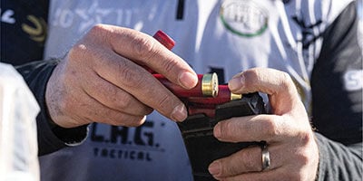 shooter loading Federal Action Shotgun into a magazine