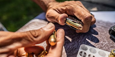 Federal Handgun ammo being loaded into a magazine