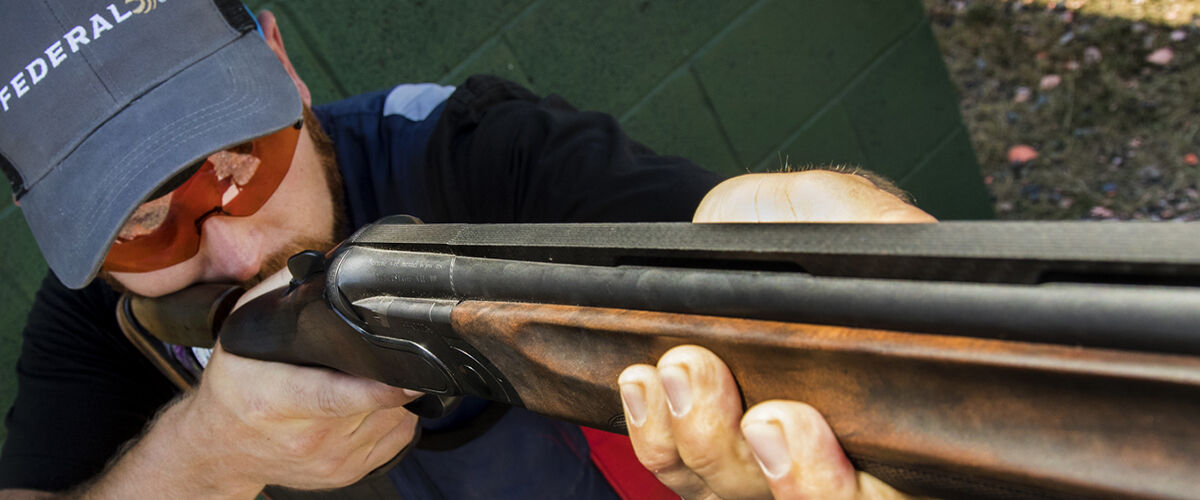 Vincent Hancock looking down the barrel of a shotgun