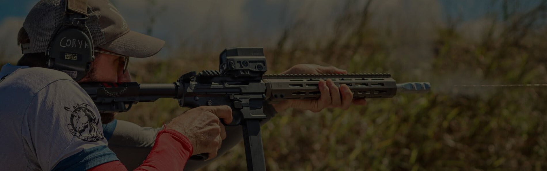 Cory Klemashevich looking down the sights of a rifle