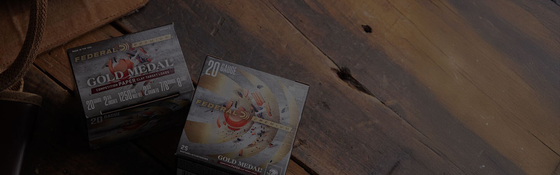 2 boxes of Gold Medal Paper laying on a table with an ammo bag