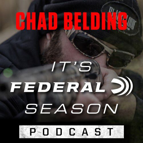 Chad Belding aiming a shotgun