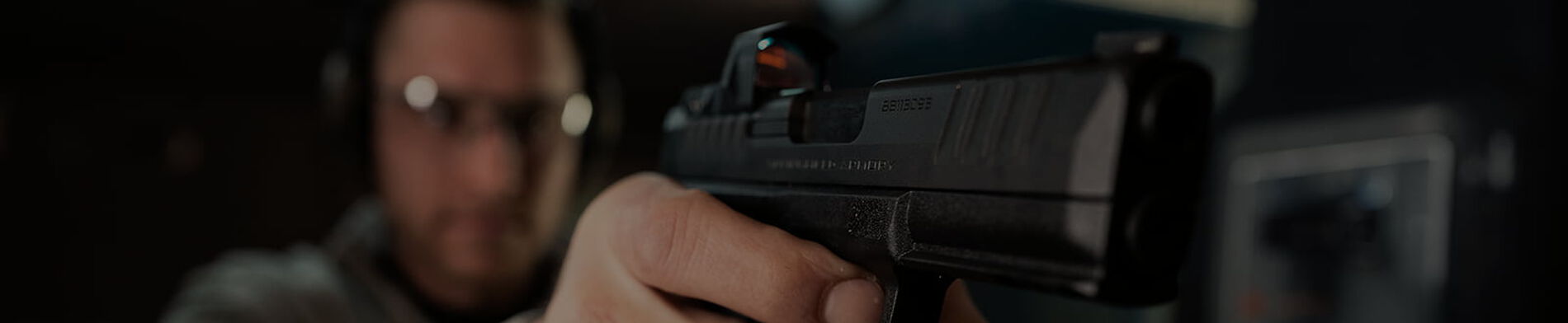 shooter aiming pistol
