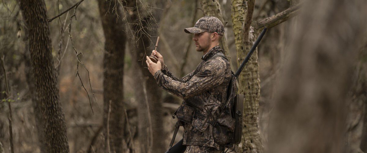 hunter using a turkey call
