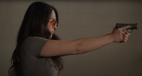 Krystal Dunn shooting a pistol