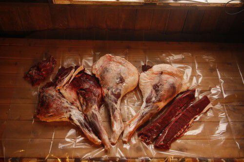 All collected deer meat layed out on a table