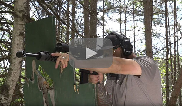 Josh Froelich with gun rested on wooden support