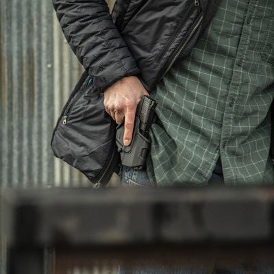 Person loading HST into a pistol