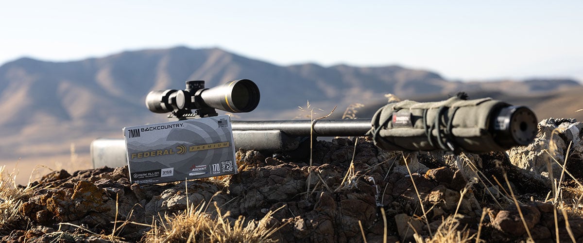 rifle laying on the ground with a box of 7mm backcountry Terminal Ascent