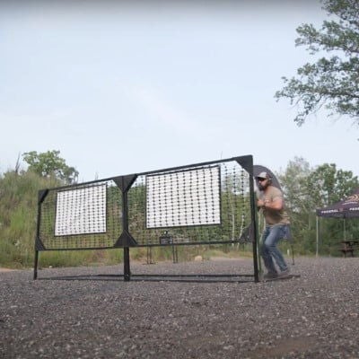 Josh Froelich standing behind an obstacle outside