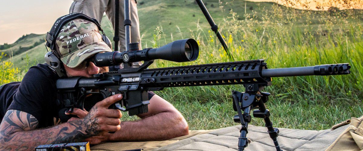 shooter looking through the scope of a rifle