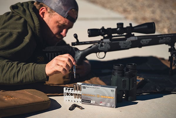 Nick removing Terminal Ascent 7mm backcountry cartridge from box