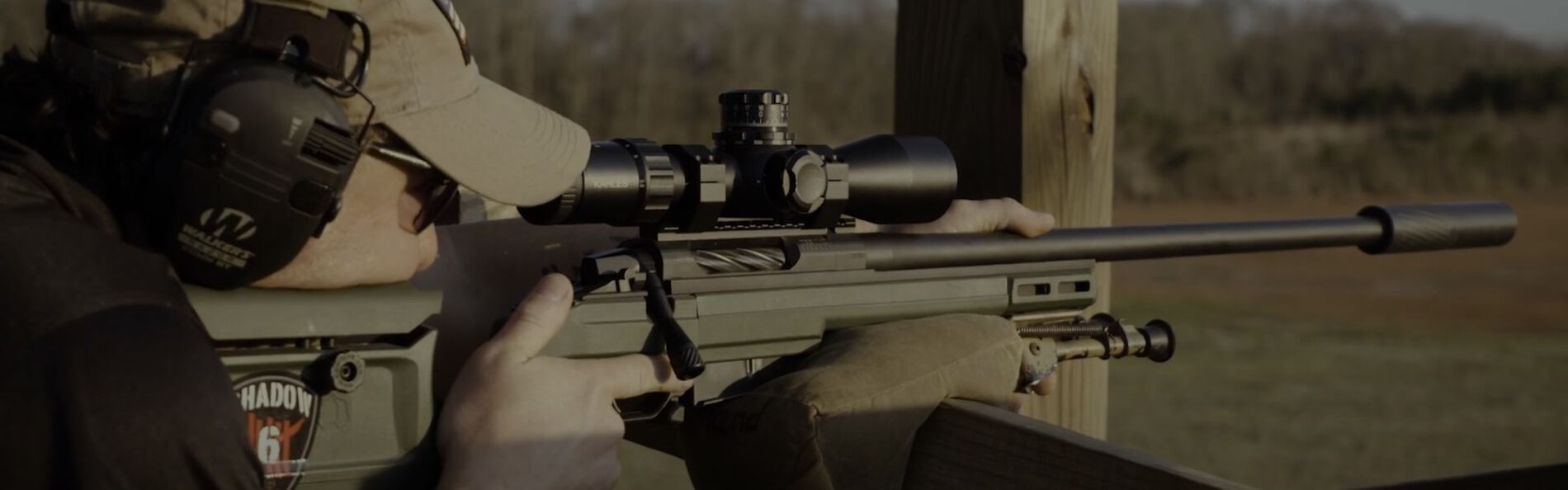 Jim Gilliland shooting a rifle at an outdoor range