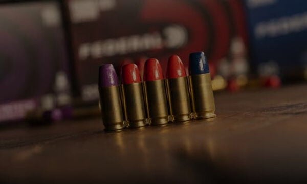 different syntech handgun cartridges lined up on a table