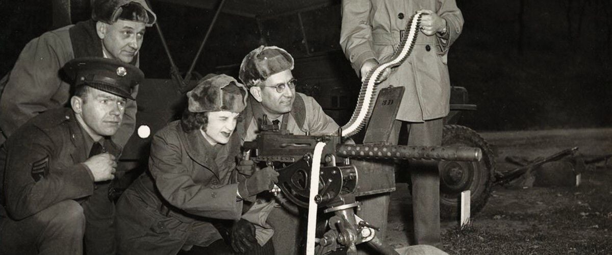 Women aiming a large military gun