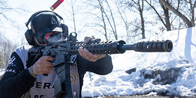 shooter shooting shotgun outside