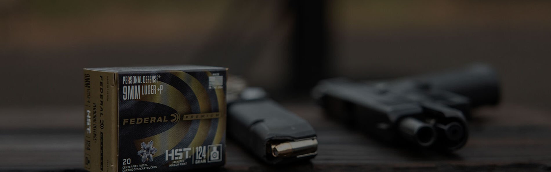 HST pox on a table next to a loaded magazine and handgun