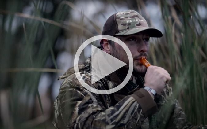 hunter using a duck call