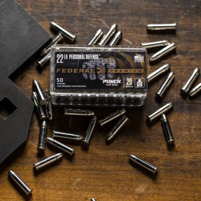 Punch 22 LR Packaging on top of Punch 22 LR cartridges