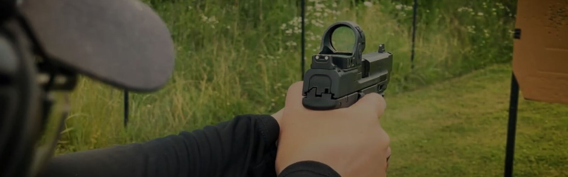 Julie Golob aiming a handgun