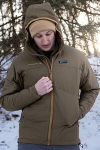 male wearing the Cirque jacket outside in the snow