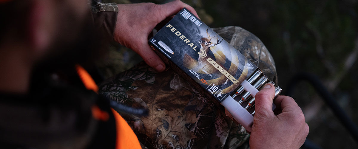 hunter holding Trophy Bonded Tip box