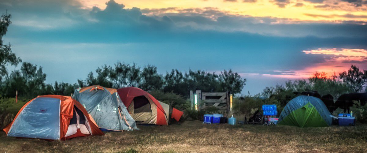 A couple tents set up for camping