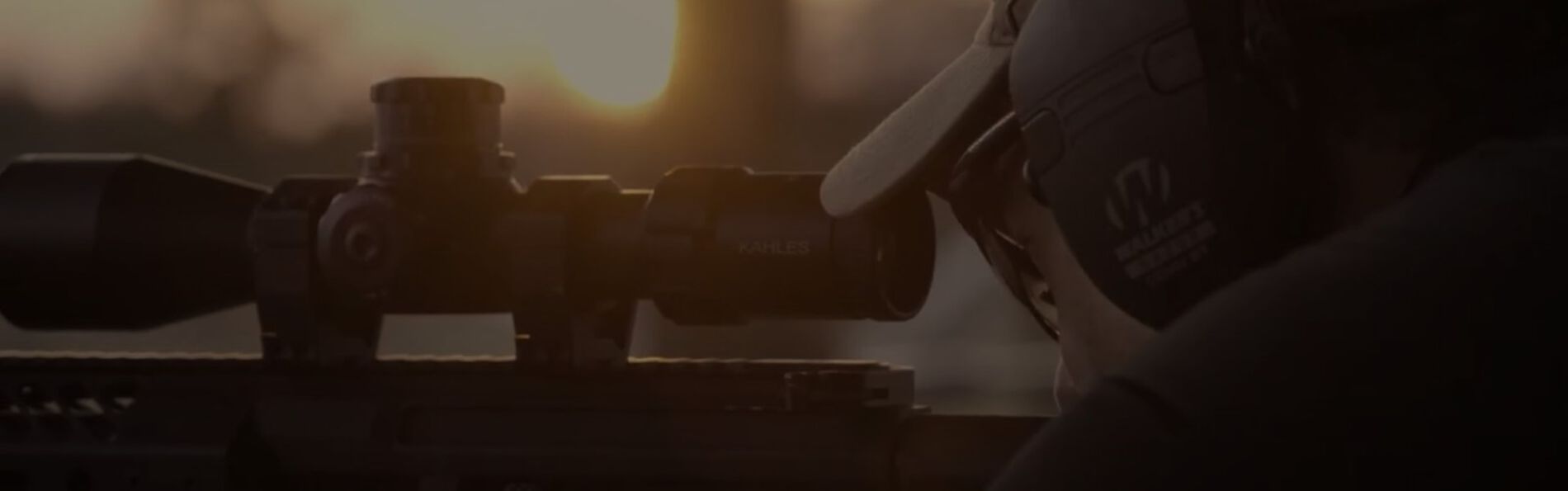 shooter looking down a rifle scope