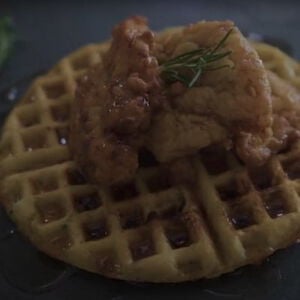 fried upland game sitting on top of a waffle