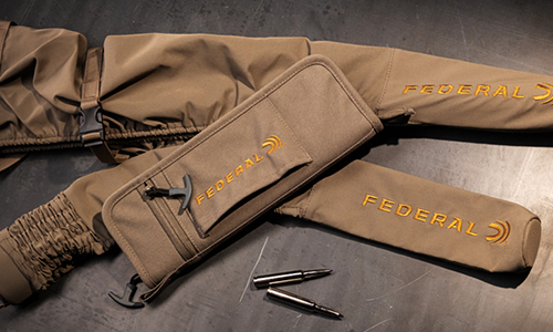 Suppressor Case, Federal Fit Quick Strike Cover and Federal Fit Coil Rifle Cober on a table with Federal Ammo