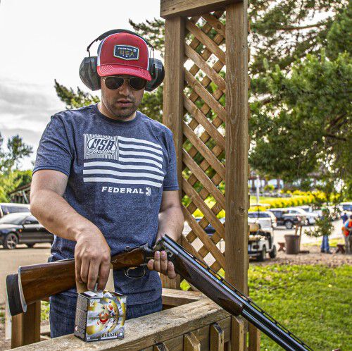 Man loading shotgun