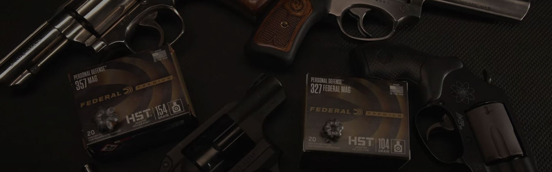 magnum handguns on a table with Federal HST