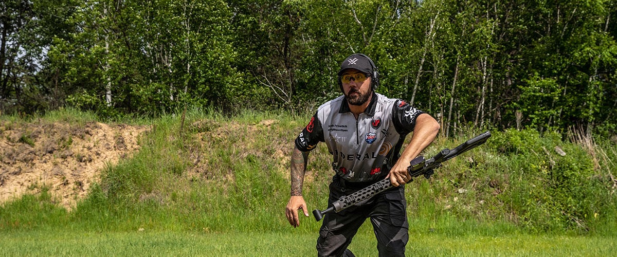 Josh Froelich holding a gun