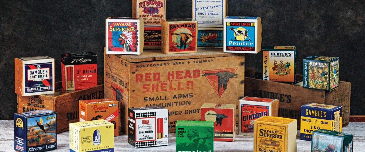ammo boxes sitting on top of a wooder box with Red Head Shells written on it